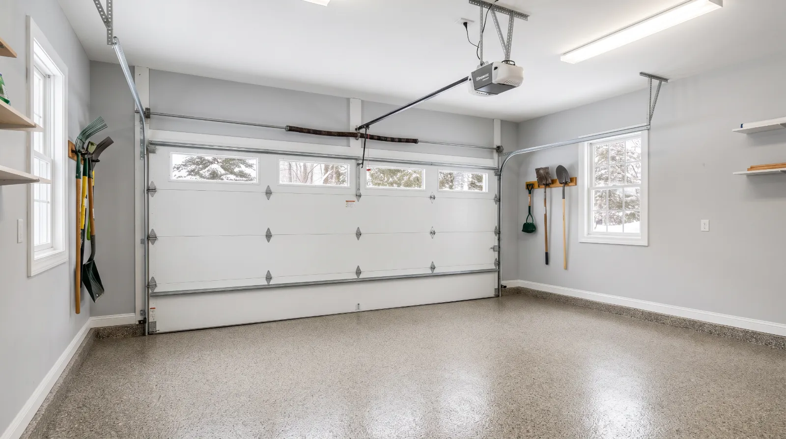 Attached garage with an insulated steel door and torsion spring